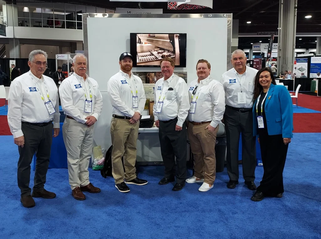 Photo of the Kuhl Corporation Team, Pictured left to right; Kevin Kuhl, Jeff Kuhl, Bryan Kuhl, Rick Kuhl, Rick Kuhl Jr, Carlos Sanchez and Raquel Torres.